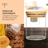 A split image showing product features and the product itself. The left side has text and a close-up of spices in a jar. The right side shows a clear glass jar with a bamboo lid. Produktbild-Vorschau