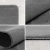 A collage of four close-up images showing different angles and textures of a gray rug. Podgląd zdjęcia produktu