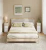 A bedroom scene with a bed, nightstands, and artwork on the wall. Produktbild-Vorschau