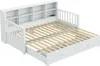 A white daybed with a slatted mattress base extended, showing storage drawers underneath and a bookshelf headboard. Náhled obrázku produktu