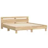 A wooden bed frame with a headboard, shown against a white background. Voir les images du produit