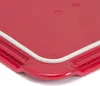 A close-up view of the corner of a red cutting board with a white edge. Produktbild-Vorschau