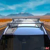 A car with a roof rack driving on a road with mountains in the background. Náhľad obrázku produktu