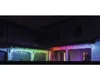 A house exterior at night, decorated with colorful LED icicle lights along the roofline. Náhled obrázku produktu
