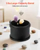 Rocks are falling into a black tumbler on a white table. Náhled obrázku produktu