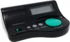 A black digital alarm clock with a green button and gray buttons. Produktbild-Vorschau