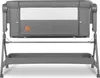A front view of a gray baby crib with a white mesh window and a small orange logo on the side. Produktbild-Vorschau