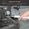 A hand holding a bottomless portafilter handle of an espresso machine. Náhled obrázku produktu