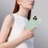 A person holding a phone with a sparkly blue case. Produktbild-Vorschau