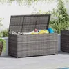 An outdoor storage box filled with pool toys, placed on a patio next to a pool. Podgląd zdjęcia produktu