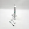 A white electric toothbrush with a green button and two replacement brush heads on a white background. Produktbild-Vorschau