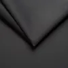 A close-up, abstract view of dark gray fabric, showing folds and texture. Produktbild-Vorschau