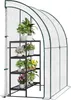 A greenhouse with shelves filled with potted plants. Náhľad obrázku produktu