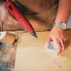 A person is using a red hot glue gun to repair wood. Anteprima dell’immagine prodotto