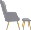 A side view of a gray fabric armchair and ottoman on a white background. Náhľad obrázku produktu