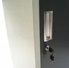 Close-up of a gray lock with two keys, attached to a dark gray surface. Produktbild-Vorschau