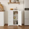 A white cabinet with drawers and an open door, displaying kitchen items, is placed in a kitchen setting next to a refrigerator. Náhled obrázku produktu