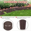 A garden fence made of brown plastic in a wood-like design, bordering a lawn and flower bed. Náhled obrázku produktu
