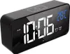 A digital alarm clock with a mirrored display showing the time and temperature. Podgląd zdjęcia produktu