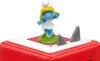 A Smurfette figurine stands on a red and white cube with two shark fins protruding from the surface. Produktbild-Vorschau