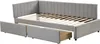 A grey upholstered daybed with two open storage drawers underneath, shown from a slightly elevated side angle against a white background. Produktbild-Vorschau