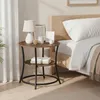 A bedside table next to a bed. Voir les images du produit