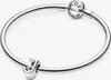 A silver Pandora bracelet with a charm shaped like the letter 'J' and a clasp with the Pandora logo. Produktbild-Vorschau