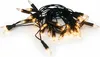 A tangle of black wire string lights with clear bulbs. Voir les images du produit