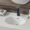 A modern bathroom sink with a black faucet and folded towels. Podgląd zdjęcia produktu