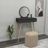 A vanity table with a mirror and stool in a room. Produktbild-Vorschau