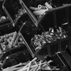 A close-up, black and white image of several stacked storage bins filled with hardware. Produktbild-Vorschau