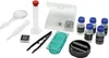 A collection of science experiment tools, including a magnifying glass, dropper, test tube, tweezers, petri dish, and small bottles. Produktbild-Vorschau