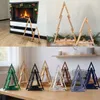 A collage of images showing wooden Christmas trees in different settings and colors. Náhled obrázku produktu