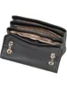 An open black Guess handbag with gold chain details. Produktbild-Vorschau