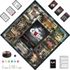 A top-down view of the Cluedo board game laid out on a black surface, with cards and game pieces scattered around. Produktbild-Vorschau