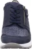 A close-up front view of a navy blue women's sneaker with a textured toe box and a side zipper. Náhľad obrázku produktu