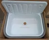 A white sink with a gray rim is shown inside a cardboard box. Náhled obrázku produktu