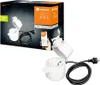 The image shows the packaging of a smart plug and the product itself, along with a smartphone displaying a smart home app. Náhled obrázku produktu