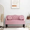 A pink velvet bench with tufted details and round cushions is shown in a room with a mirror and a piece of abstract art on the wall. Náhľad obrázku produktu
