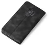 A black flip cover phone case is shown from a diagonal top-down perspective on a white background. Produktbild-Vorschau