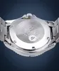 The back of a watch is shown in close-up against a blue background. Podgląd zdjęcia produktu