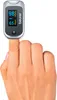 A finger wearing a Beurer Pulsoximeter PO 40. Podgląd zdjęcia produktu