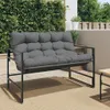 A grey outdoor bench with cushions is shown on a patio with a green hedge in the background. Náhled obrázku produktu