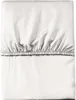 A white fitted sheet is folded and laid flat against a white background. Anteprima dell’immagine prodotto