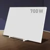 A white infrared heater with a stand is shown in a room with dark blue walls and a wooden floor. Produktbild-Vorschau