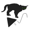 A black cat silhouette with green eyes, a triangular base, a screw, a nut, and a metal stake on a white background. Voir les images du produit