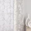 A close-up view of a sheer curtain with an ornate pattern. Produktbild-Vorschau