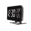 A digital clock with a stand, displaying the time, temperature, and humidity. Produktbild-Vorschau