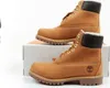 A pair of Timberland boots are displayed on top of a white box. Produktbild-Vorschau