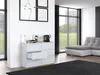 A modern living room with a white dresser, a sectional sofa, and large windows. Anteprima dell’immagine prodotto